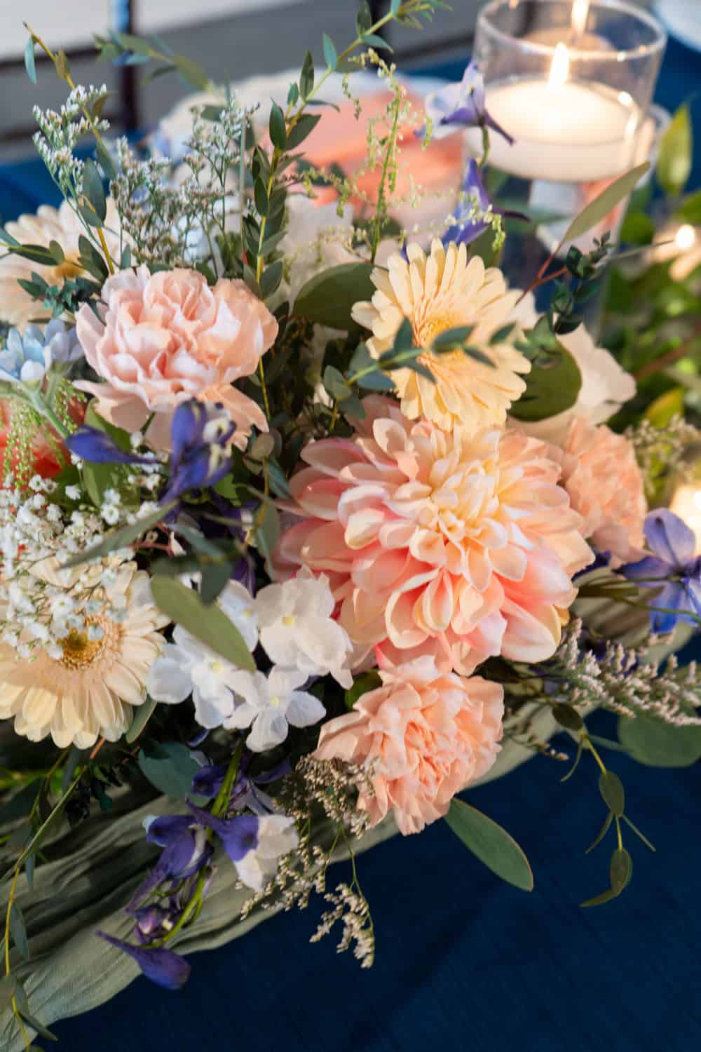 Beautiful pastel flower bouquet with candles for SKY Armory event.