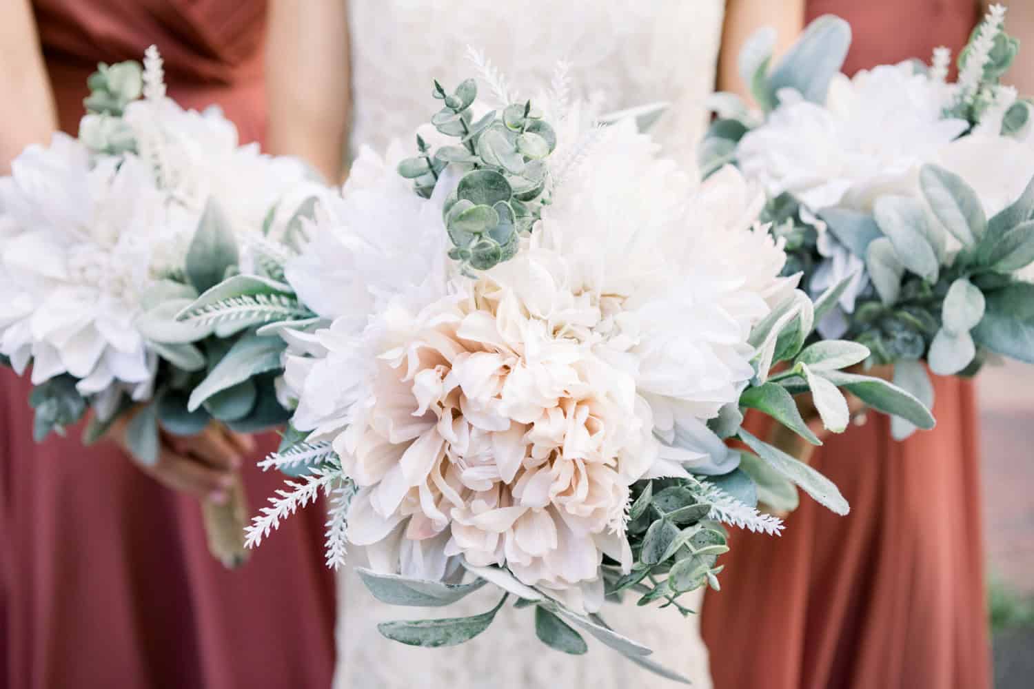 Beautiful wedding bouquet with white flowers and greenery for bridal accessories.