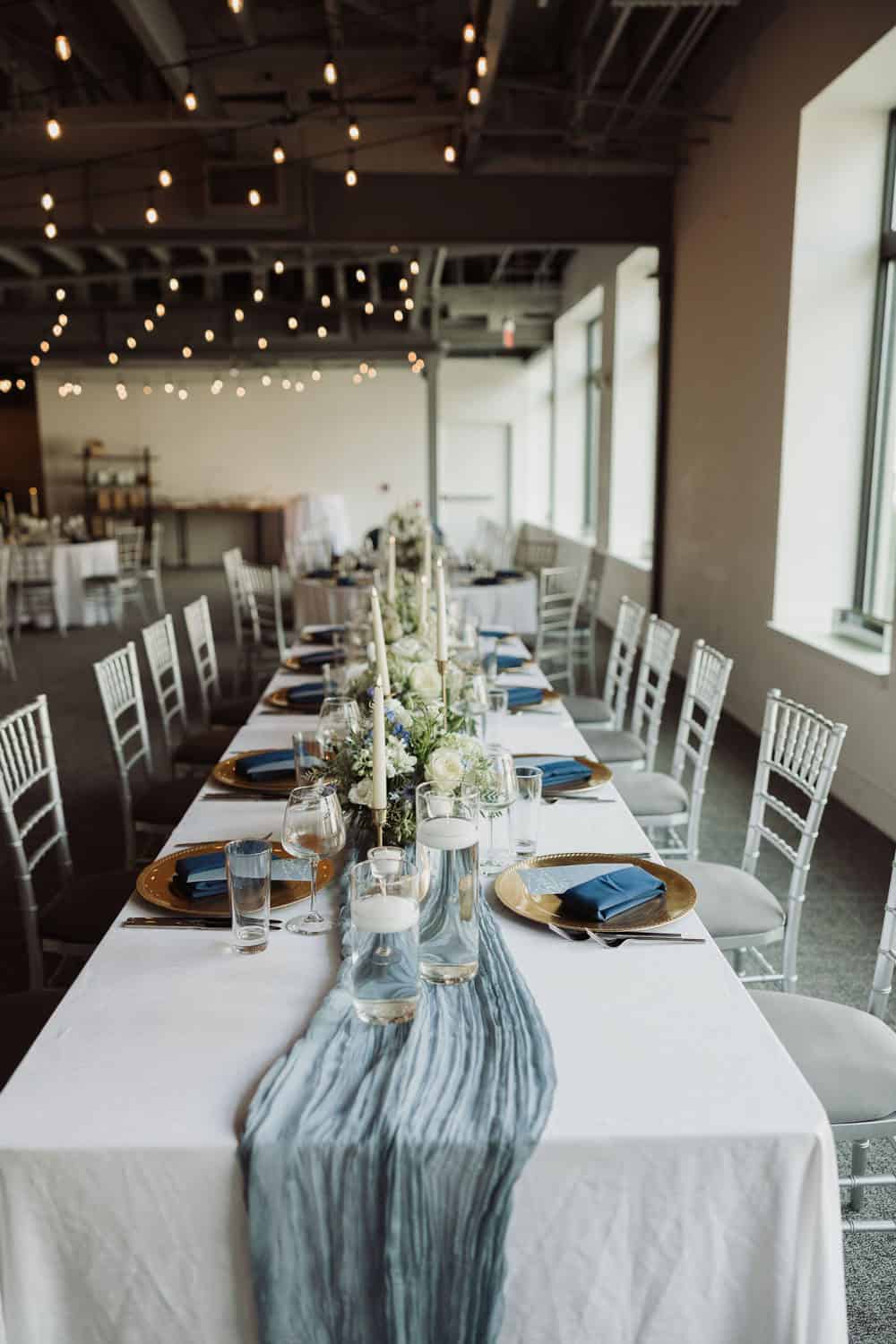 Beautiful wedding reception table with floral centerpiece and elegant decor.