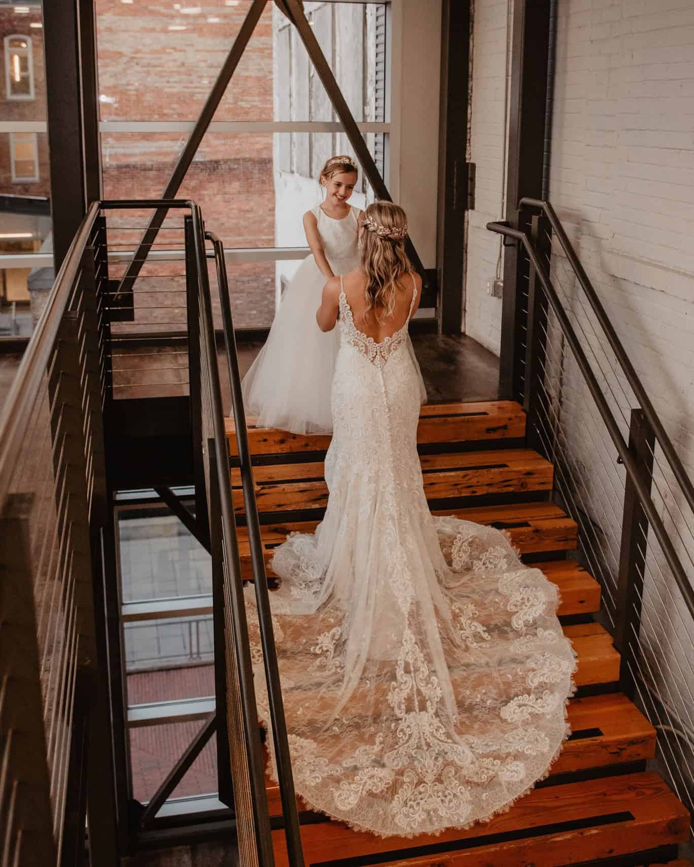 Bride and bridesmaid in wedding dresses at SKY Armory.