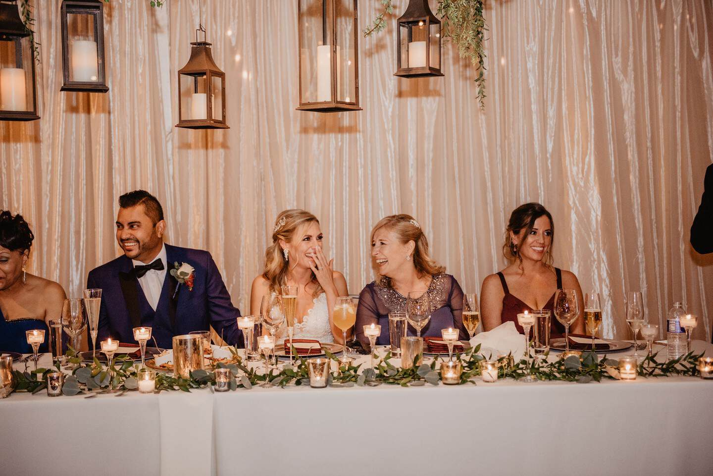 Guests enjoying a wedding reception with elegant decor and candlelit ambiance at SKY Armory.