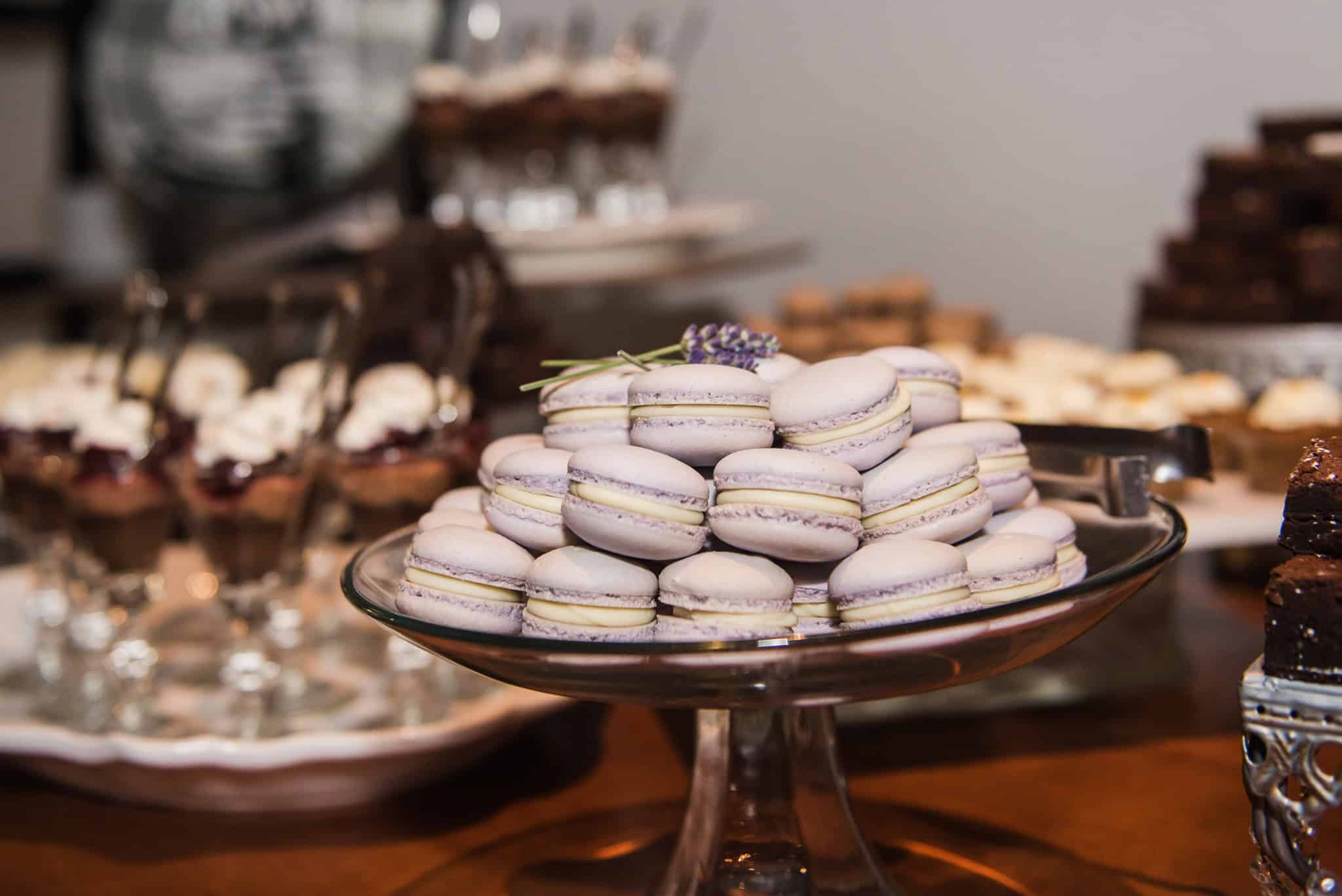 Assorted lavender and vanilla macarons on a silver platter at SKY Armory.