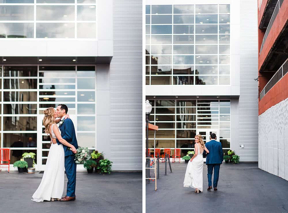 Bride and groom kissing outside Sky Armory building in downtown.