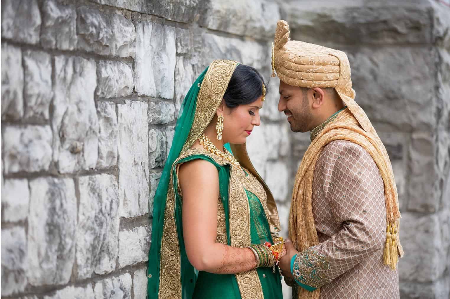 Indian bride and groom in traditional attire during wedding ceremony.