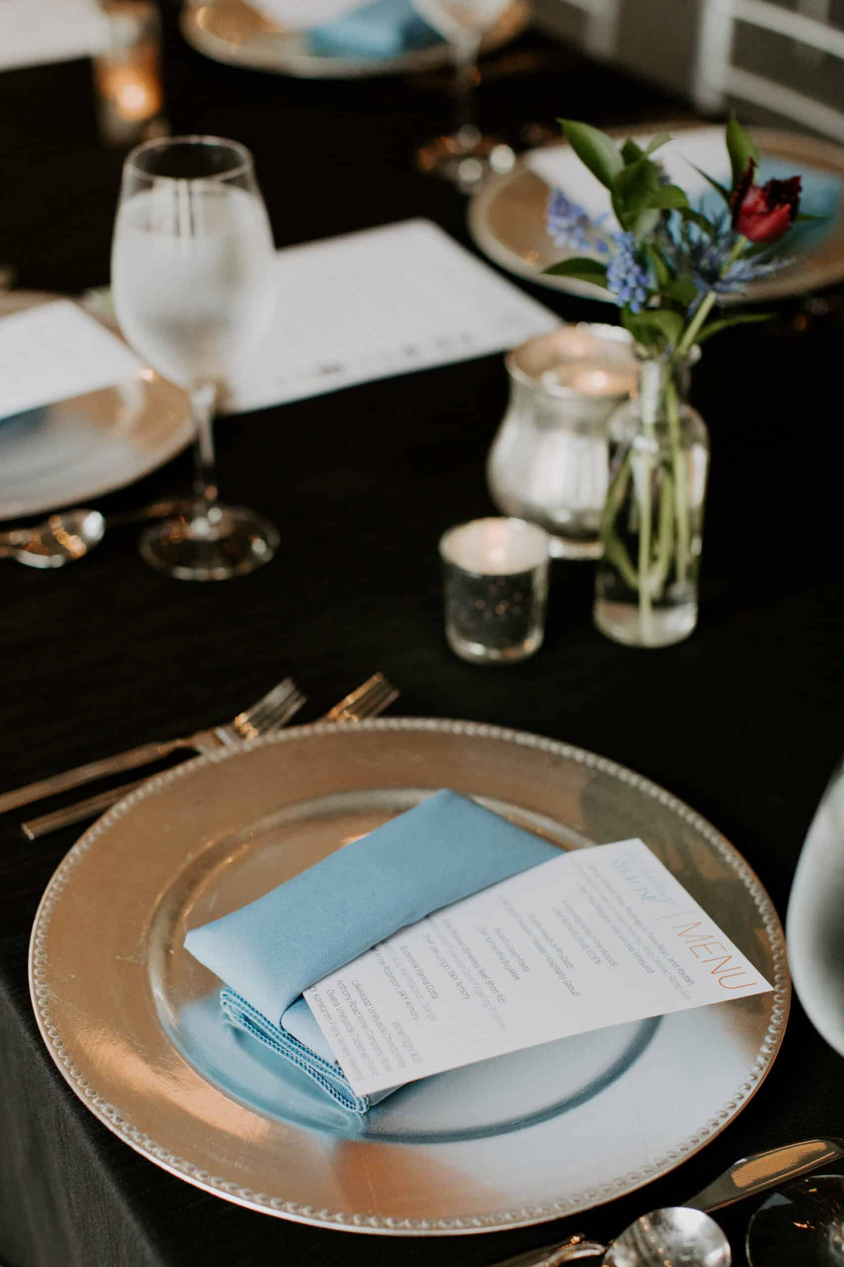 Sophisticated table setup with floral centerpiece and fine dining ware at SKY Armory.