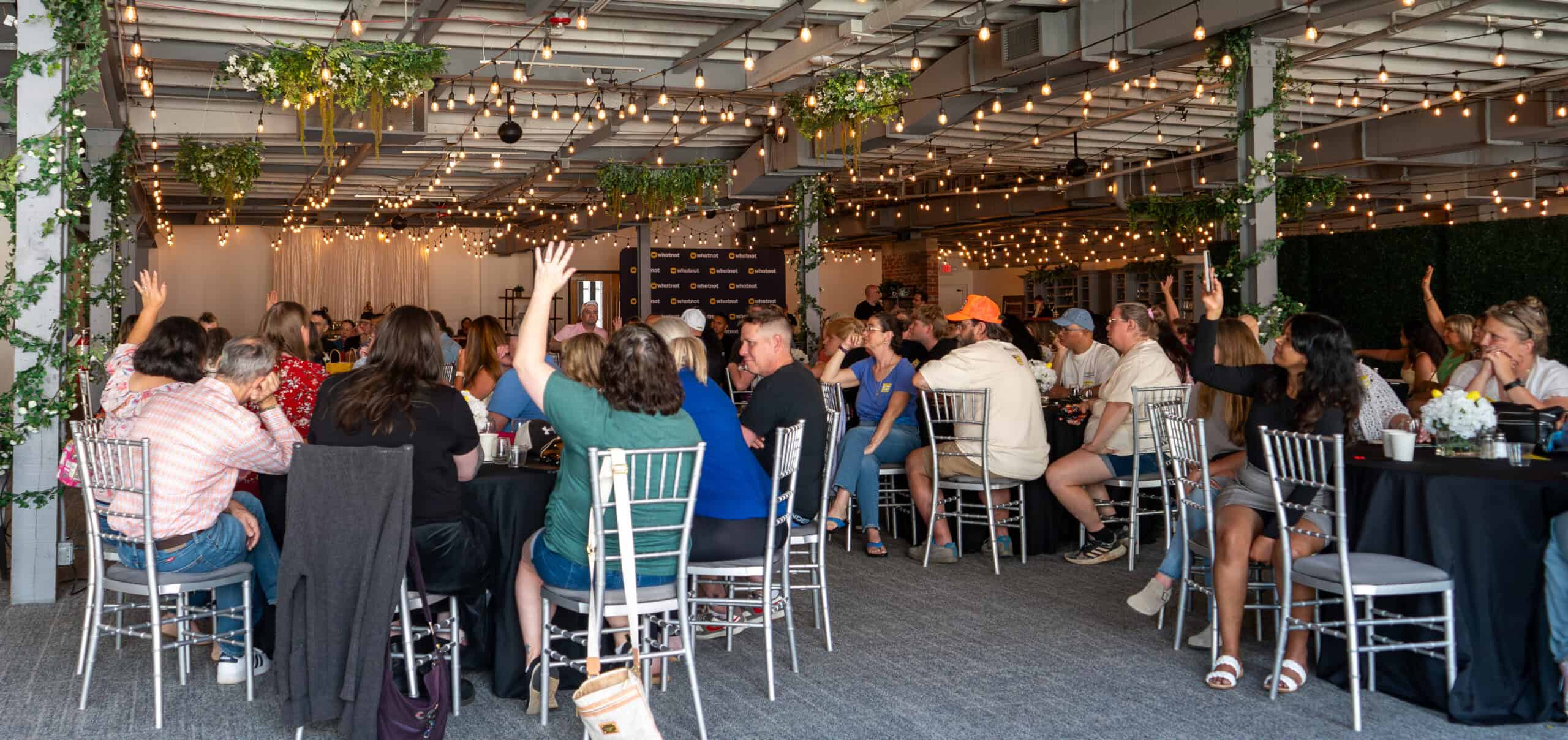 Attendees at Sky Armory networking event engaging in discussions.