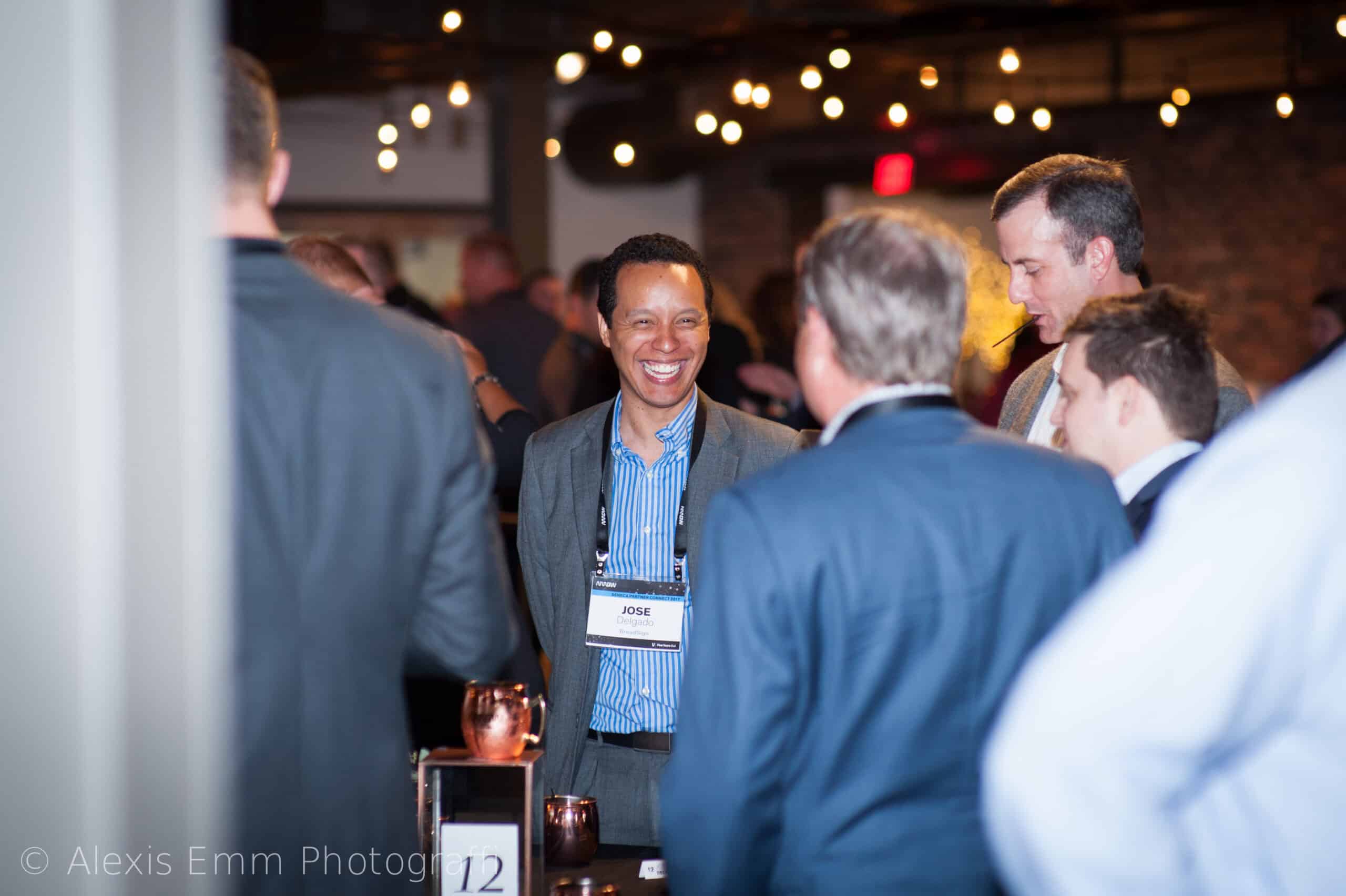 Business professionals networking at SKY Armory event in New York City.