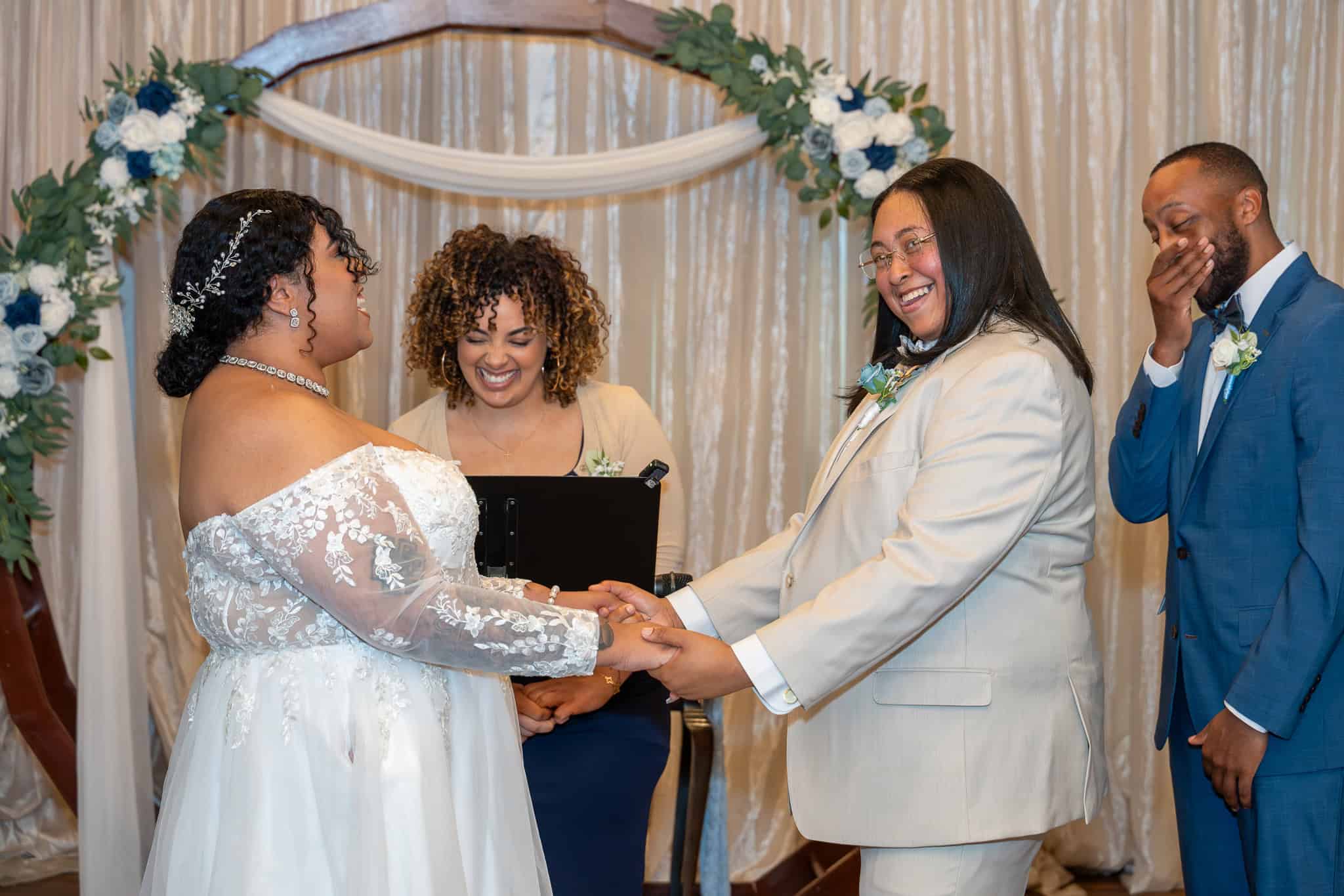 Couple exchanging vows at SKY Armory wedding venue in Central New York.
