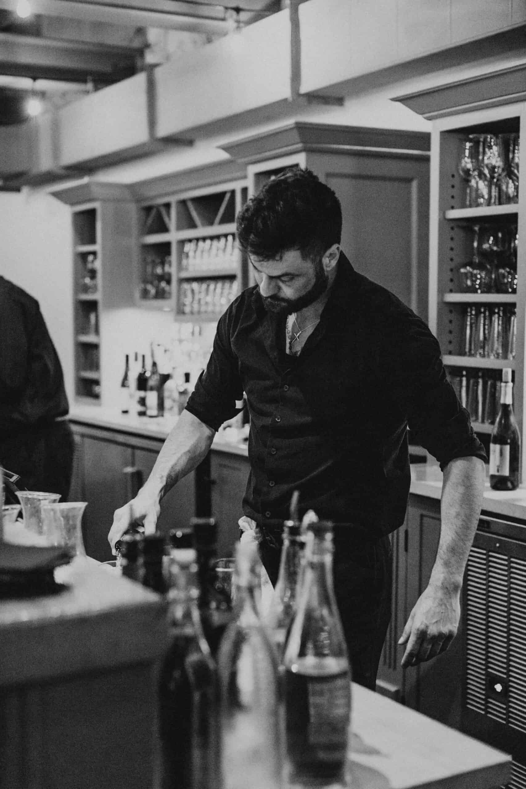 Skilled bartender mixing drinks at SKY Armory bar in New York City.