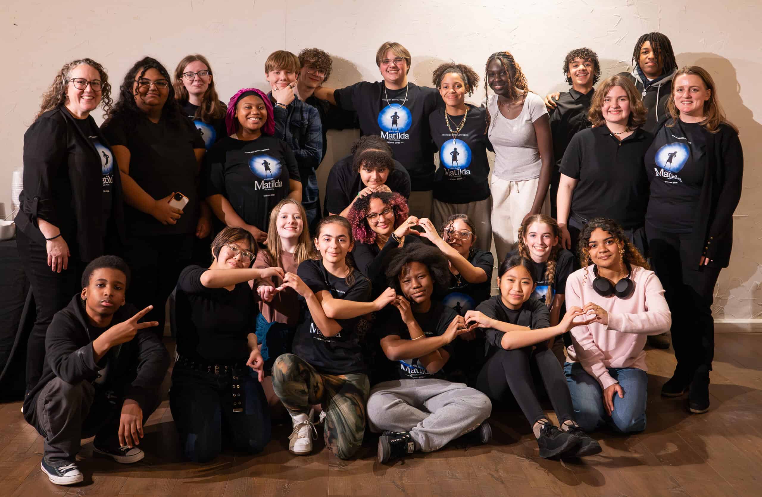 Group of diverse young people and adults at SKY Armory event.