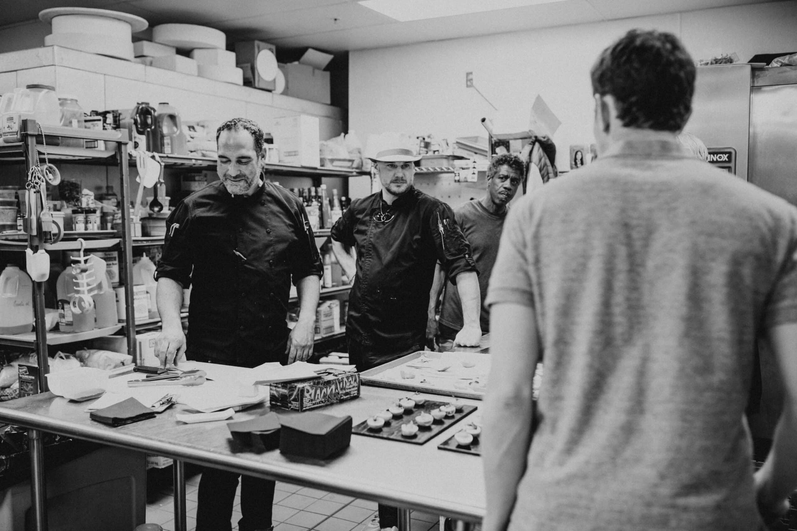 Culinary team preparing dishes in a professional kitchen at SKY Armory.