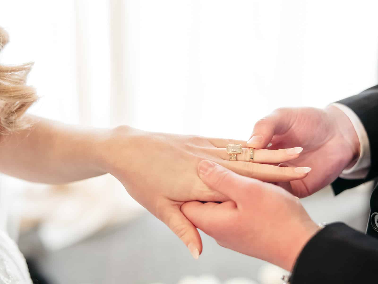 Close-up of wedding rings exchanged during a Sky Armory wedding ceremony.