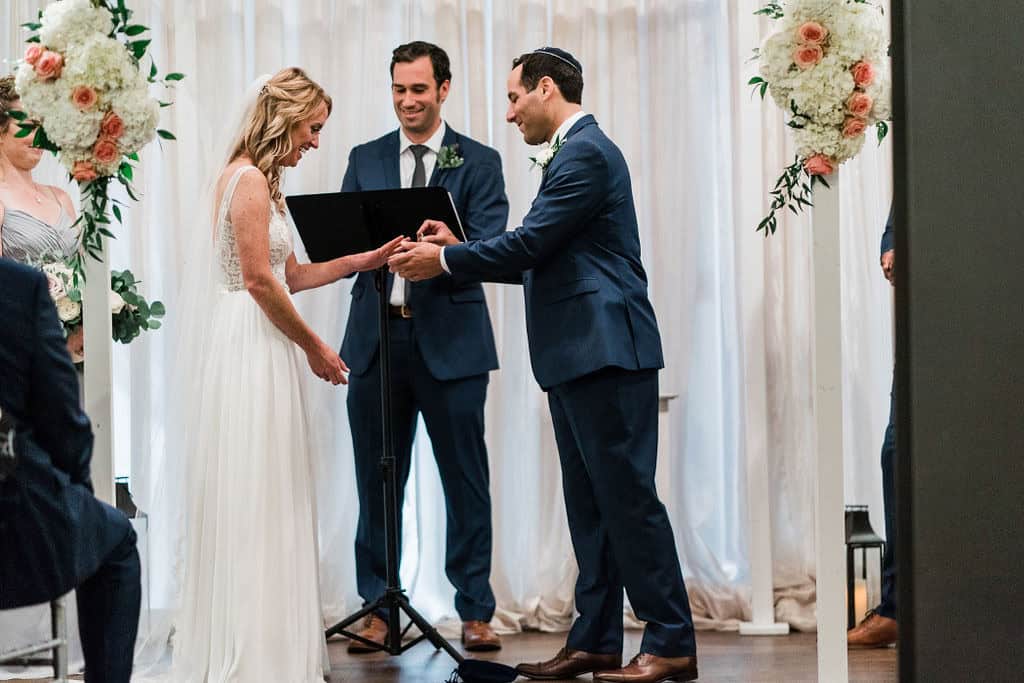 Couple exchanging vows during wedding ceremony at SKY Armory.