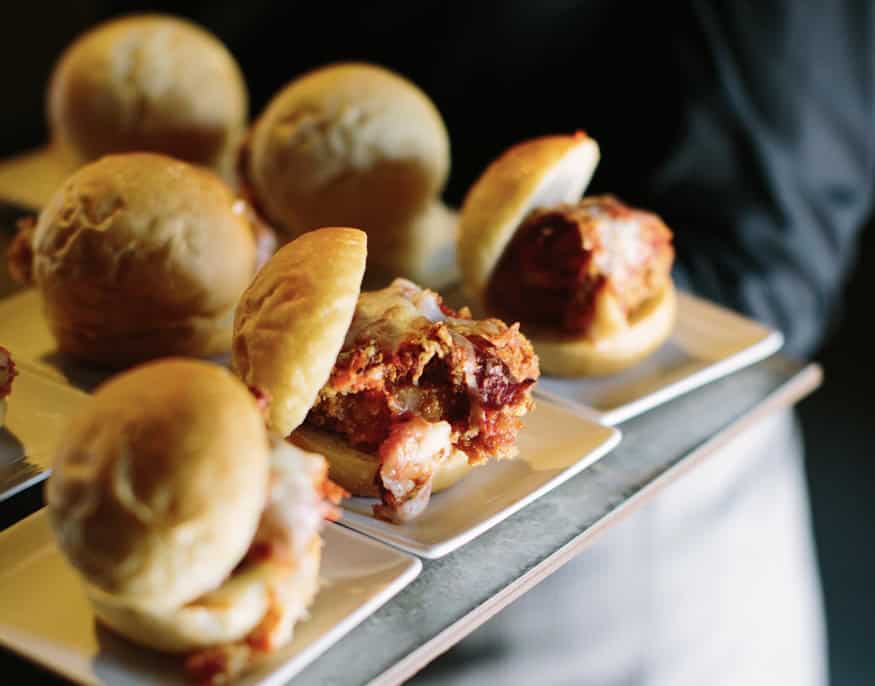 Close-up of gourmet meat sliders on a serving tray at Sky Armory.