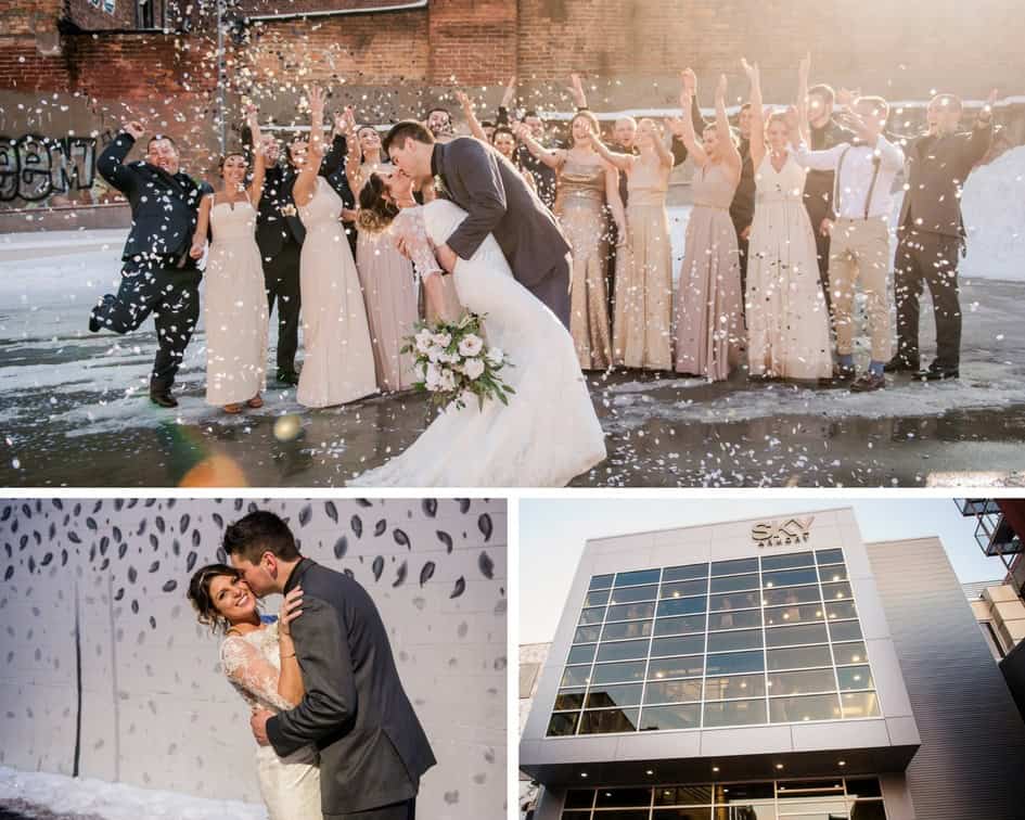Couple kissing with wedding party celebrating in winter at Sky Armory.