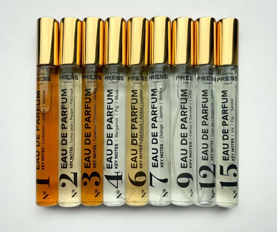 Collection of 8 SKY Armory perfume samples with numbered labels and gold caps.