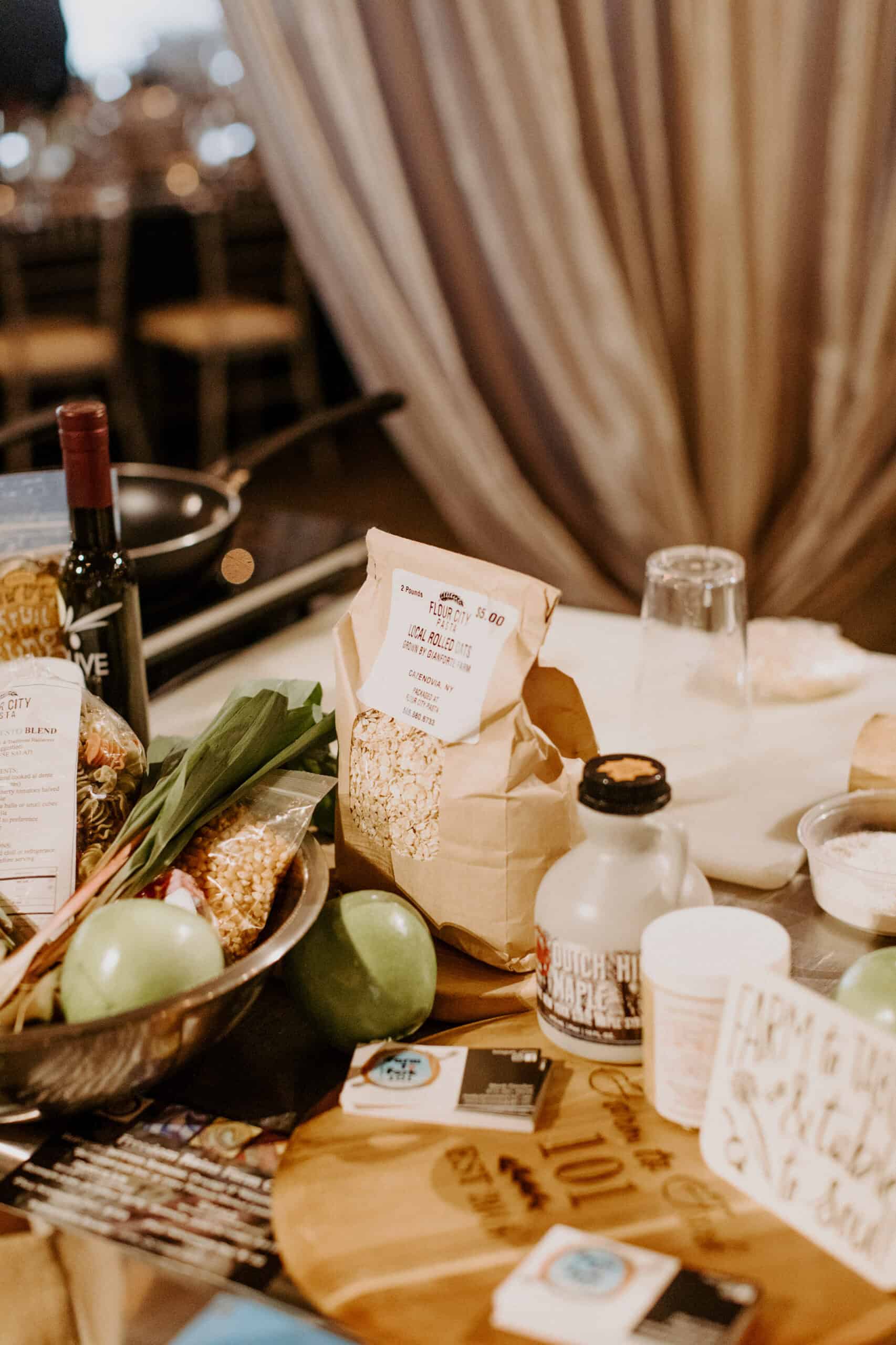 Gourmet food display with wine, cheese, and fresh produce at Sky Armory.