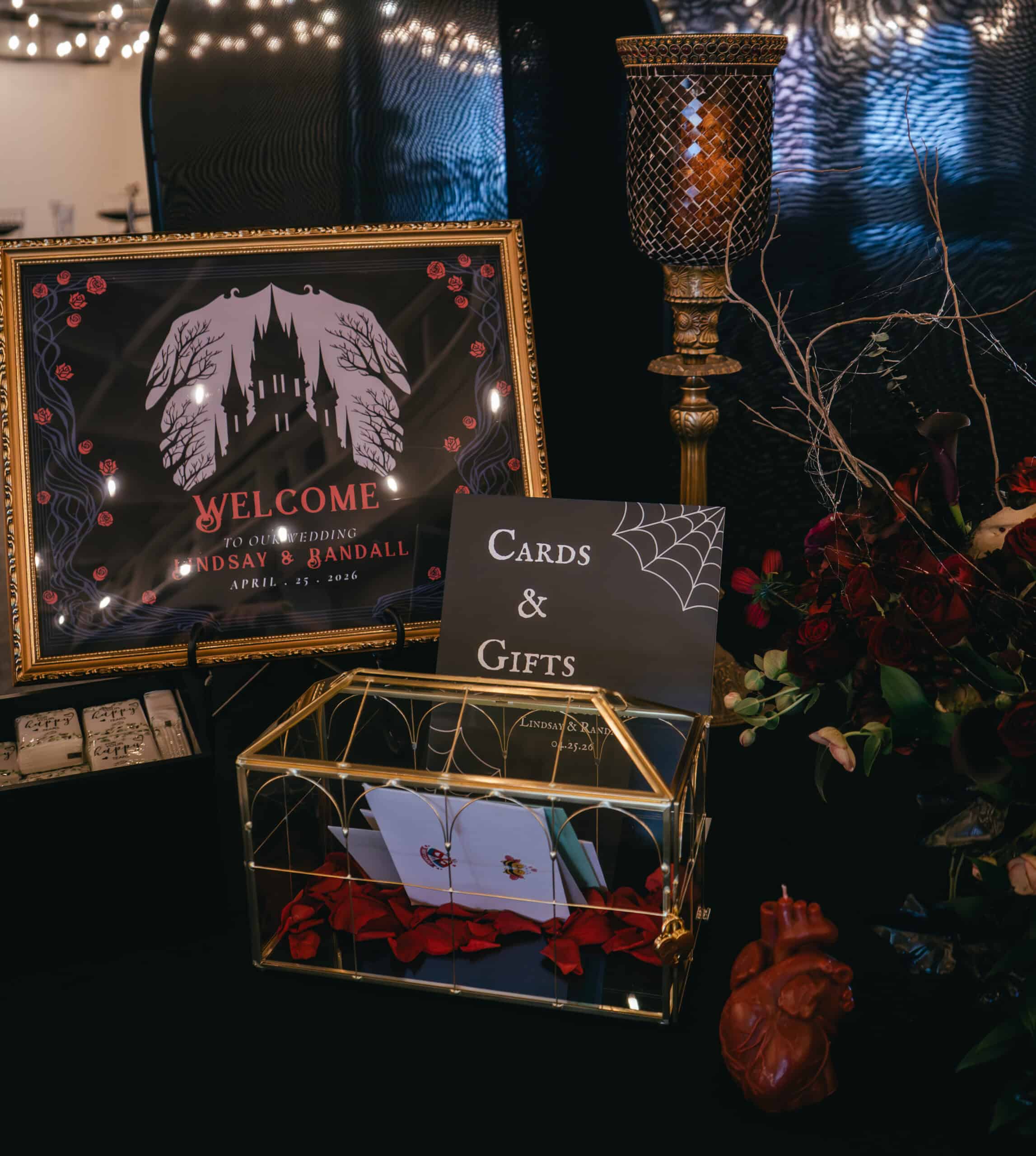 Elegant wedding display with cards, gifts, and Halloween-themed decor.