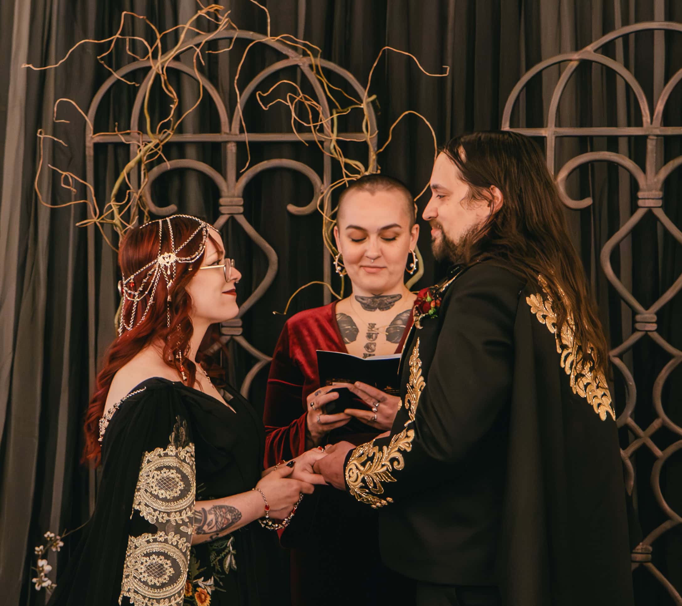 Couple exchanging vows at SKY Armory wedding with officiant present.