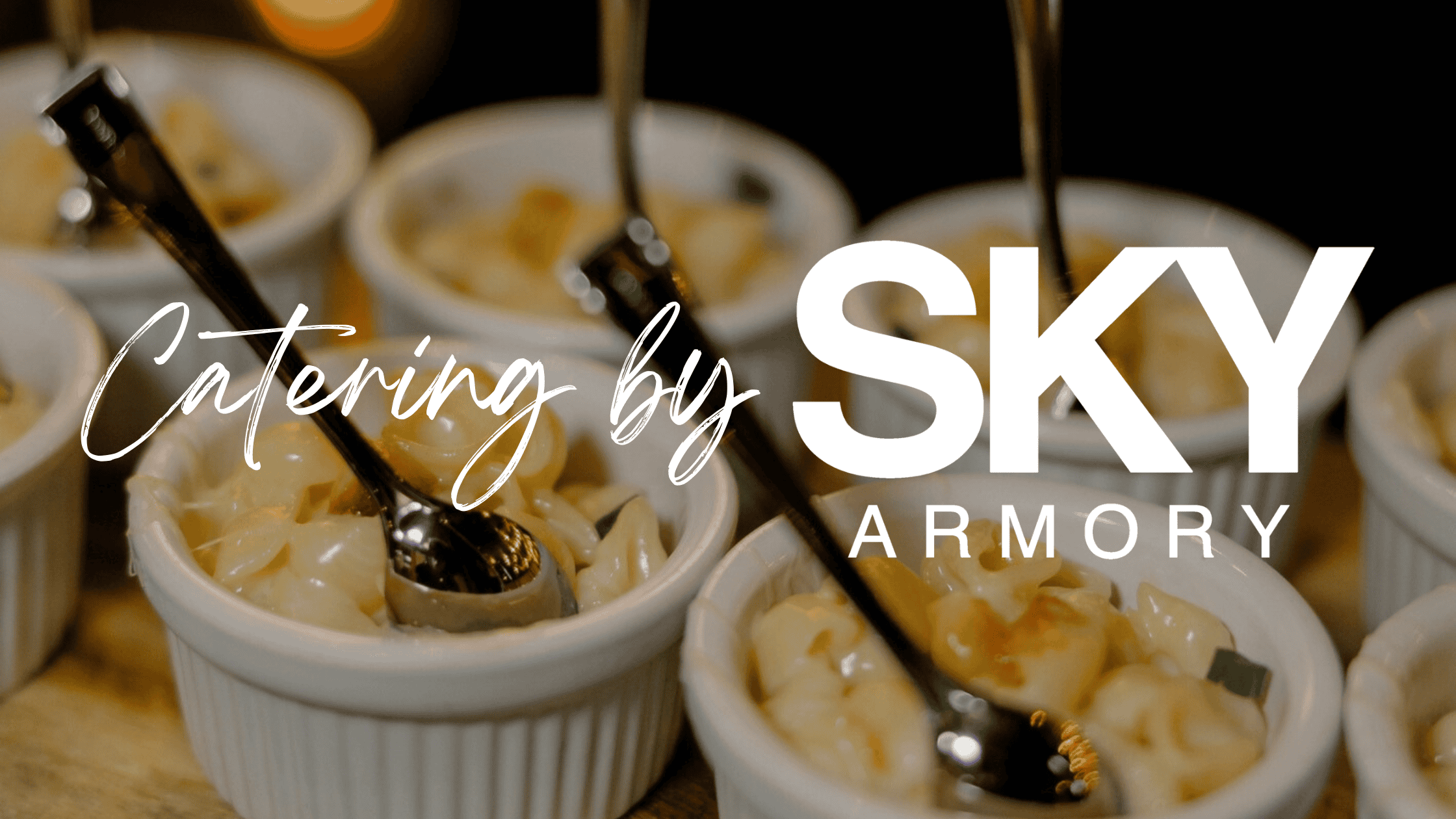 Delicious catering desserts served in small ramekins with spoons.