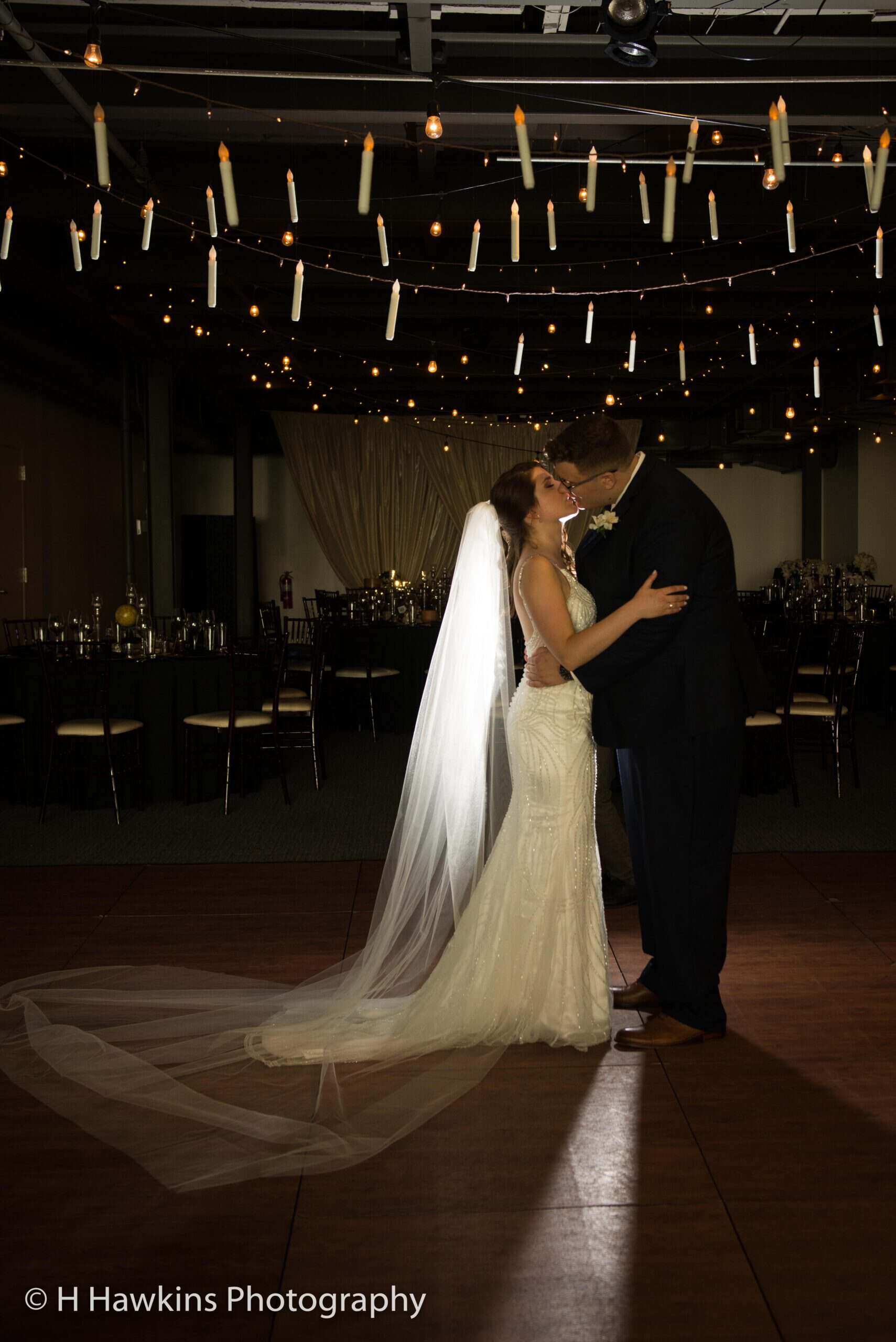 Bride and groom dancing at SKY Armory wedding reception with romantic lighting.