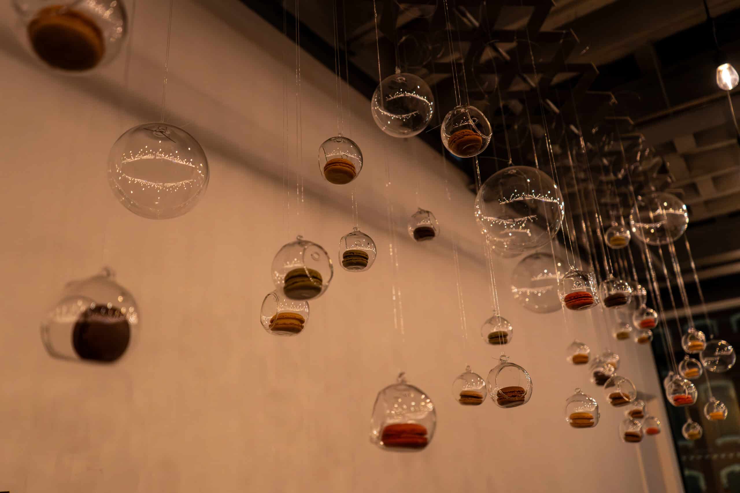 Hanging glass orbs with colorful accents at Sky Armory NYE Bash.