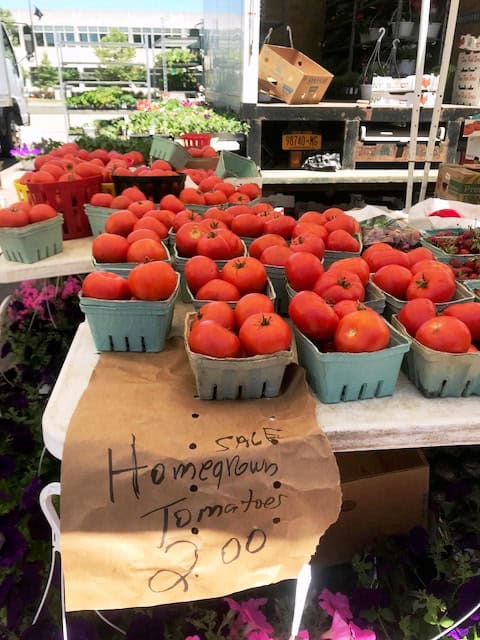 Fresh homegrown tomatoes for sale at the farmers market.