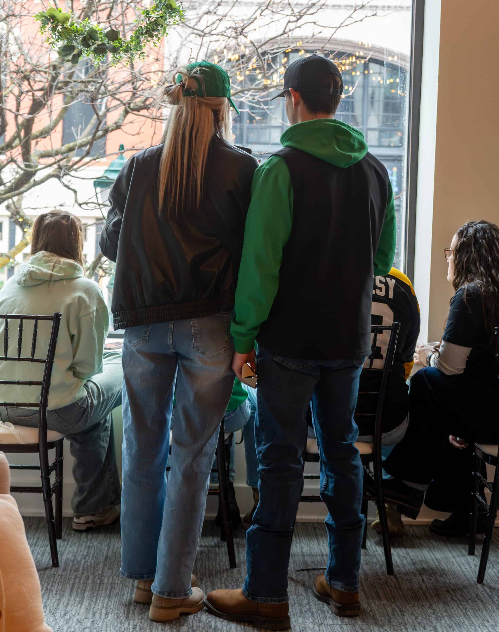 People gathered at Sky Armory during an indoor event, engaging in conversation.