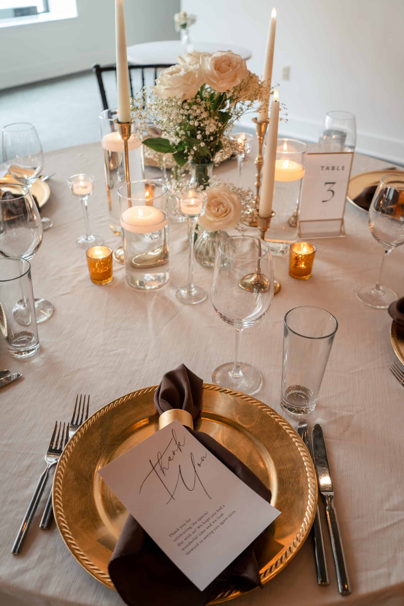 Beautiful wedding table with floral centerpiece and candles for elegant event.