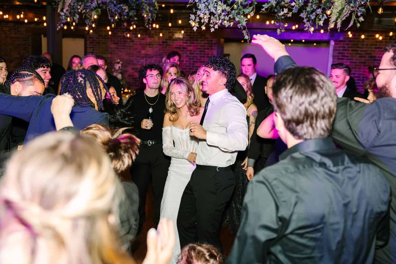 People dancing and celebrating at SKY Armory event venue.